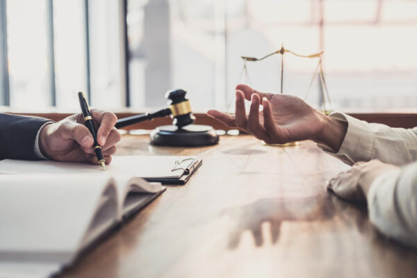 Two people having a legal discussion in an office