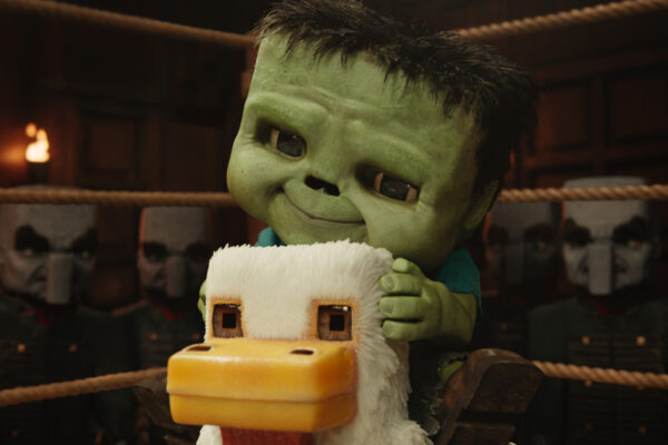 A zombie baby sitting on a chicken in a boxing ring in A Minecraft Movie