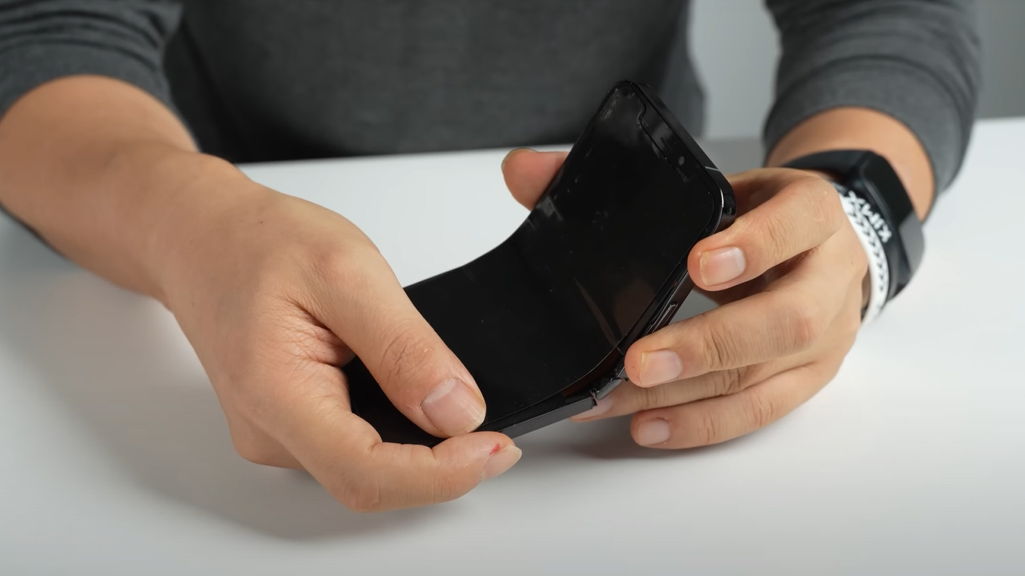 An unofficial foldable iPhone in someone's hand