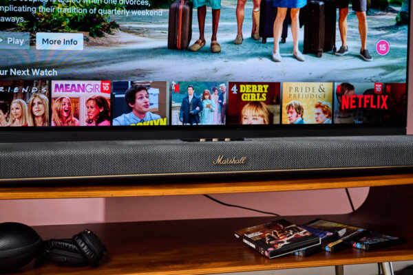Marshall Heston 120 below TV with Marshall headphones and 4K UHD Blu-rays below that