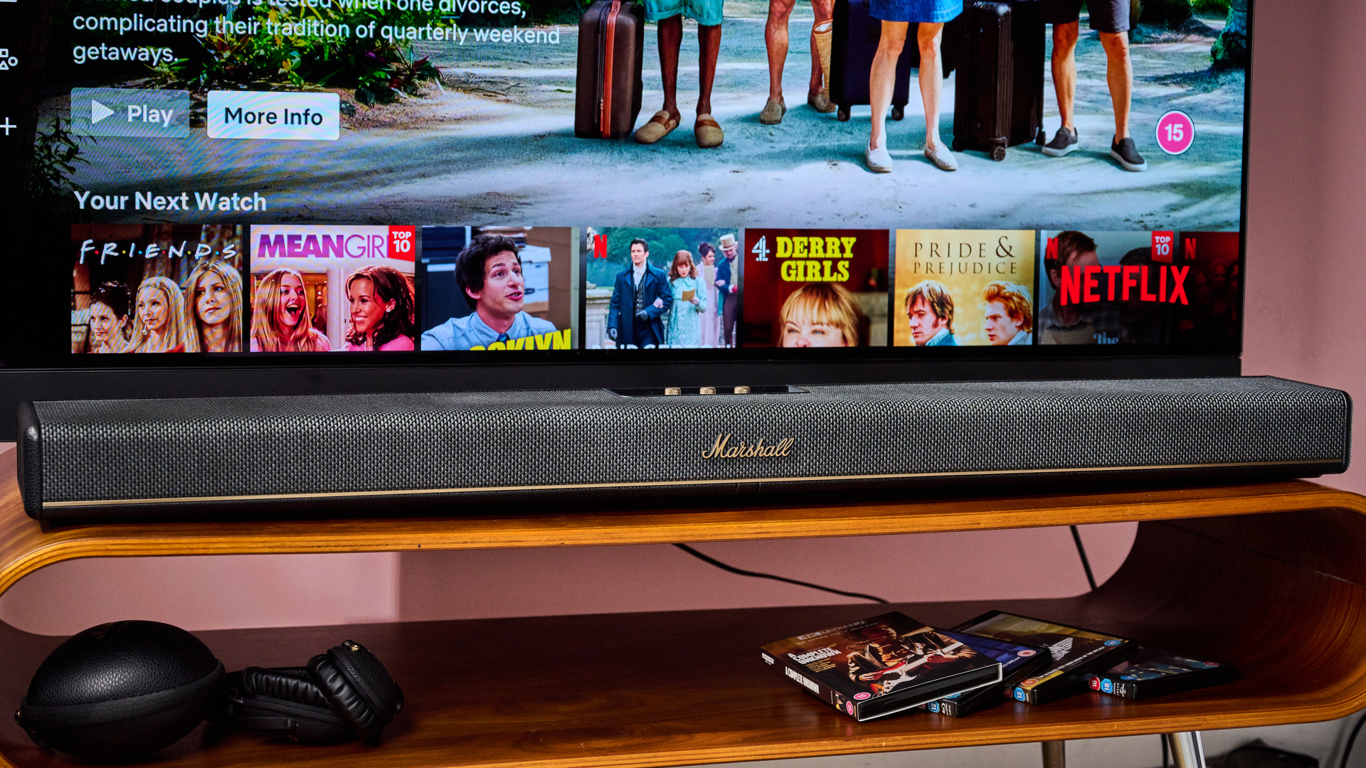 Marshall Heston 120 below TV with Marshall headphones and 4K UHD Blu-rays below that