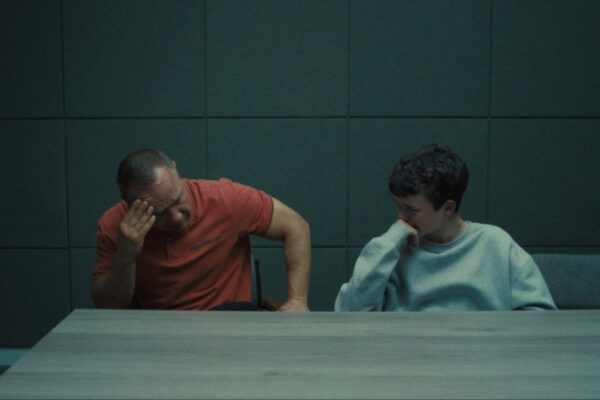 Eddie and Jamie crying in a police interview room in Netflix