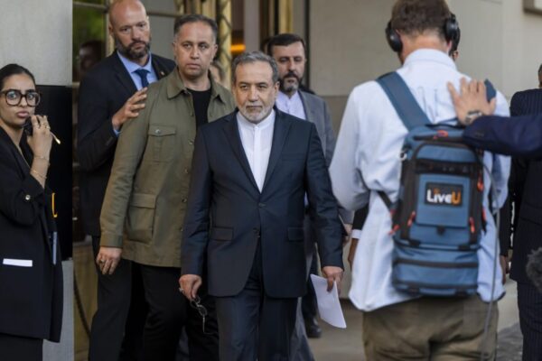 Iranian Foreign Minister Abbas Araghchi talking to the media in front of the Intercontinental Hotel, after a meeting of foreign ministers of German