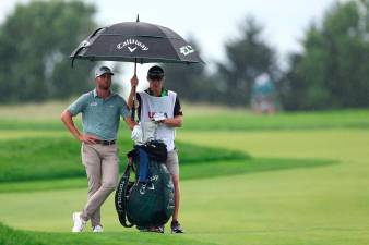 US Open resumes with Burns leading at rain-soaked Oakmont