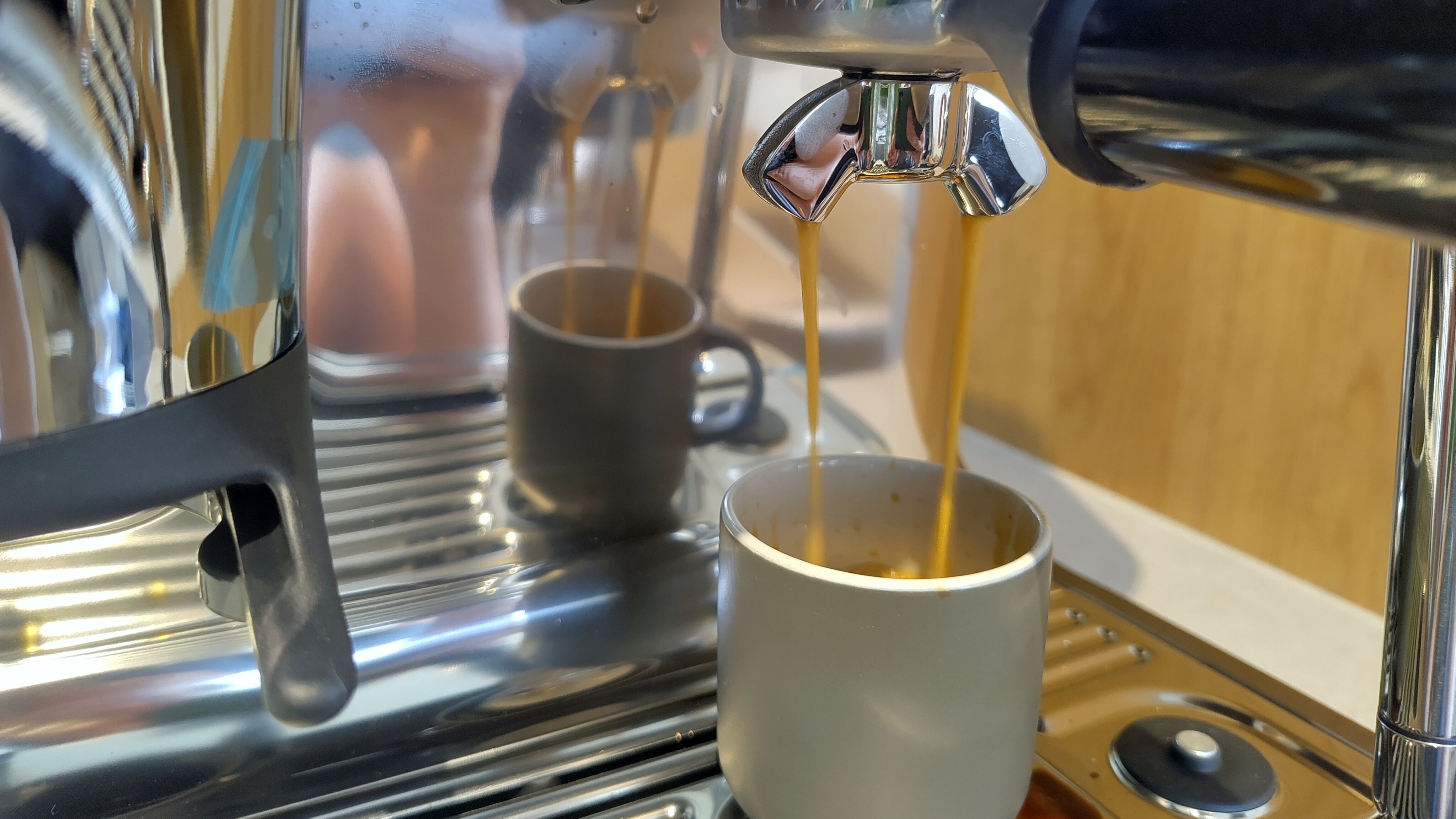 Sage Barista Touch Impress machine dispensing espresso