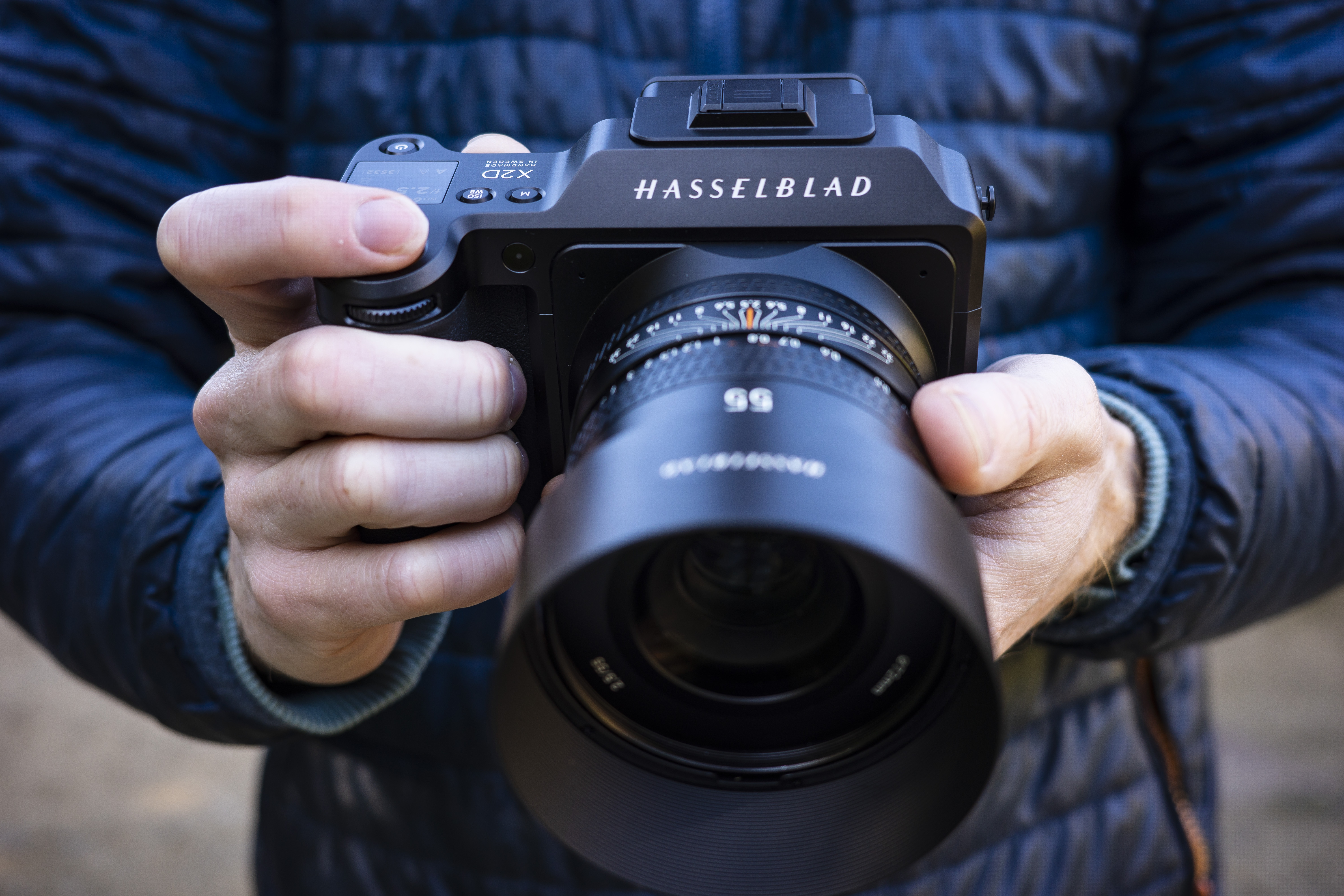Hands holding a Hasselblad camera