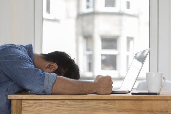 Man upset using a laptop